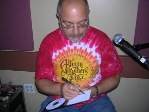 Scott signing the CD
